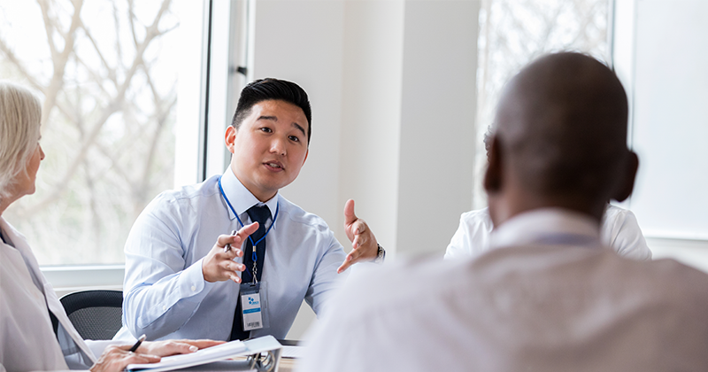 healthcare administrator at board room table