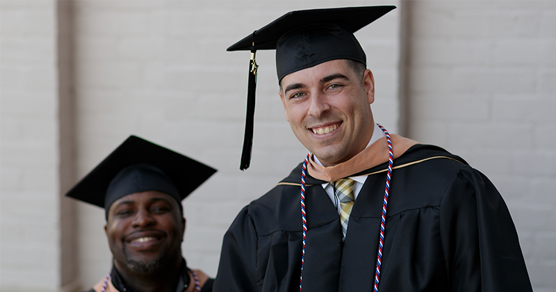 online mba graduate smiling